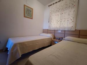 Un pat sau paturi într-o cameră la Apartamento acogedor en Cabanes, Torre la Sal, Costamar I Marina d'Or