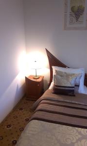 Łóżko lub łóżka w pokoju w obiekcie Hotel Bristol