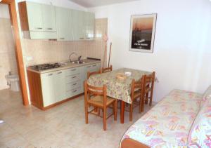 Кухня или мини-кухня в Residence Palm Garden
