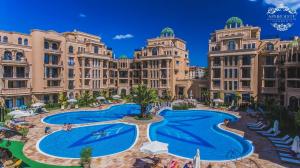 a view of a resort with two swimming pools at Апартамент под наем С208 в Афродита Гарденс in Sunny Beach