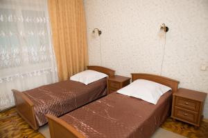 Postel nebo postele na pokoji v ubytování Dvoryanskiy Hotel