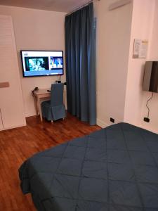 TV a/nebo společenská místnost v ubytování Locanda La Lucciola