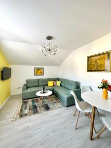 a living room with a couch and a table at Lux Apartments Minja in Pale