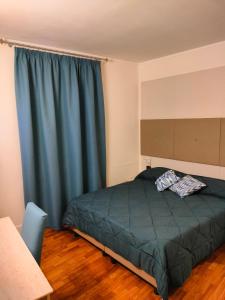 Postel nebo postele na pokoji v ubytování Locanda La Lucciola
