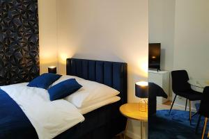 Posteľ alebo postele v izbe v ubytovaní Hugo Star Apartments