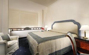 Letto o letti in una camera di Hotel De La Ville
