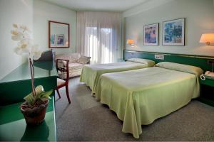 Katil atau katil-katil dalam bilik di Hotel Rey Sancho Ramírez
