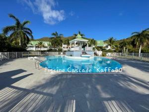 a villa with a swimming pool in a resort at Kaffa50 - Plage& 3Piscines - Anse Marcel in Anse Marcel 