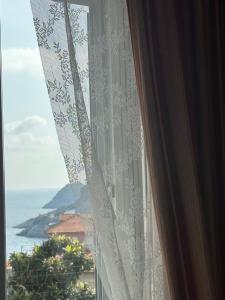 a window with a view of the ocean at Casa del sasso in Bergeggi