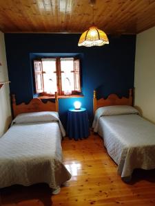Ένα ή περισσότερα κρεβάτια σε δωμάτιο στο Casa vacacional Valles Pasiegos
