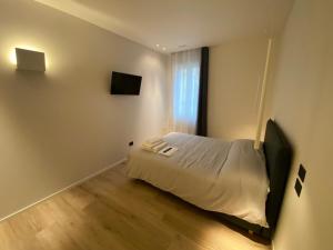 Voodi või voodid majutusasutuse Prato della Valle Apartments toas
