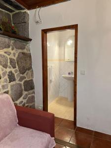 a bathroom with a shower and a toilet and a sink at Casa Padre Alexandre in Covide
