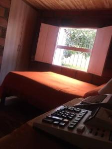 Säng eller sängar i ett rum på Acogedora casa de campo en el oriente de Antioquia