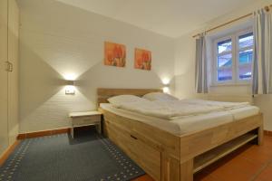 Postel nebo postele na pokoji v ubytování Strand-Wohnung am Bakenberg