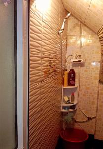 a bathroom with a shower and a red toilet at Studio near the sea for surfing lovers welcome in Safi