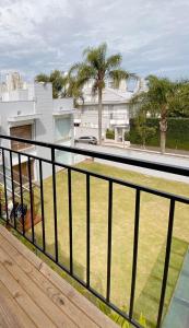 a balcony with a view of a yard at LOFT BC in Balneário Camboriú