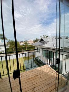 a balcony with a view of a house at LOFT BC in Balneário Camboriú