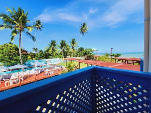 a view of the beach from the balcony of a resort at Manaí Pousada & Beach Club in Barra de Santo Antônio