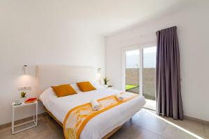 Postel nebo postele na pokoji v ubytování Villa Malvasia by Villa Plus