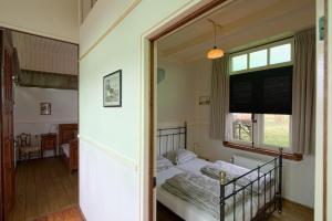 Säng eller sängar i ett rum på Halte Sint-Gerlach Holiday Home
