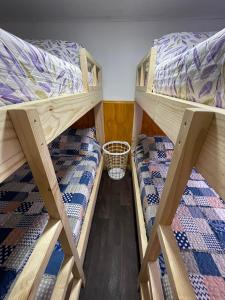 a room with two bunk beds in a room at Casa en Puerto Natales in Puerto Natales