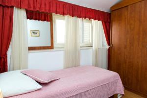 Postel nebo postele na pokoji v ubytování Apartments Lepur