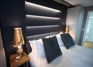 Cama ou camas em um quarto em Hotel Art Santander