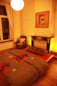 a bedroom with a large bed in a room at Guest house Heysel Laeken Atomium in Brussels