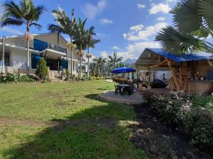 Zahrada ubytování Finca las palmeras /Cabaña de Ian