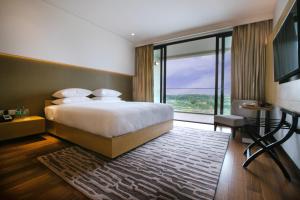 Postel nebo postele na pokoji v ubytování BLVD Club - Near BENGALURU AIRPORT