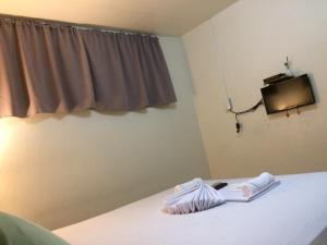 Postel nebo postele na pokoji v ubytování CrisFil's Lodge Incorporated