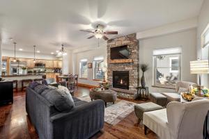 a living room with a couch and a fireplace at Black Bear Cabin with Hot Tub in Woodland Park