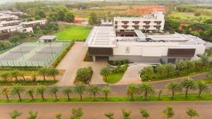 an aerial view of a building with palm trees at BLVD Club - Near BENGALURU AIRPORT in Bangalore