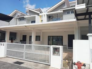 a white fence in front of a house at DAN'S Homestay Business Suite Home in Kota Tinggi