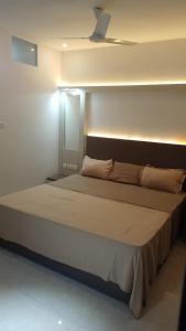 Postel nebo postele na pokoji v ubytování Central Abode Family Rooms + 7 fotografií