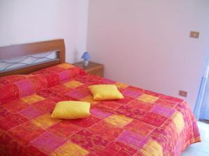 Voodi või voodid majutusasutuse Villetta La Bussola Stintino toas