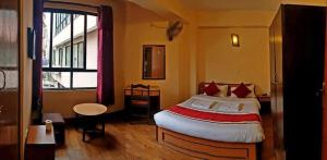 Rúm í herbergi á Hotel Premium