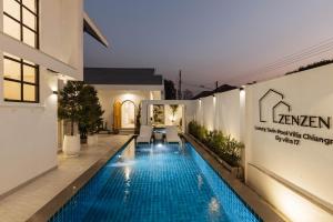 a swimming pool in the middle of a building at Zenzen Pool Villa in Chiang Mai
