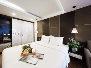 Voodi või voodid majutusasutuse Keypad Hotel - 24 Hang Ga toas