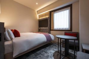 Postel nebo postele na pokoji v ubytování Hotel JAL City Haneda Tokyo