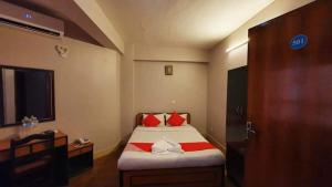 Rúm í herbergi á Hotel Premium