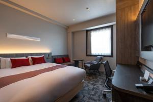Postel nebo postele na pokoji v ubytování Hotel JAL City Haneda Tokyo