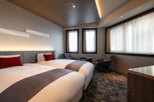 Postel nebo postele na pokoji v ubytování Hotel JAL City Haneda Tokyo
