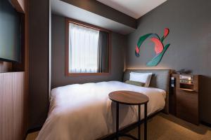 Postel nebo postele na pokoji v ubytování Hotel JAL City Haneda Tokyo