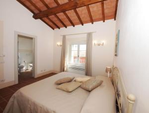 Ένα ή περισσότερα κρεβάτια σε δωμάτιο στο Agriturismo Piani Della Marina