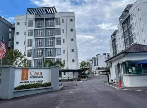 an empty parking lot in front of a building at Homestay Millazzz Apparment Ipoh in Kampong Duson Gilap