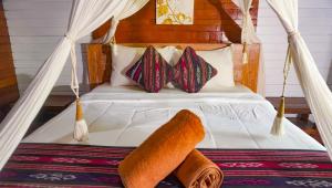 a hammock bed with two pieces of bread on it at La Nusa Penida Homestay by BIJAK in Nusa Penida
