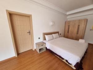 Postel nebo postele na pokoji v ubytování Palmeraiebeach Resort Rayong ปาล์มมาลี บีช รีสอร์ท ระยอง 罗勇棕榈树海滩酒店