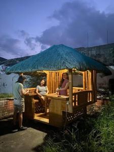 a group of people sitting on a ride in a cart at Molly's Place with kubo and parking in Angeles