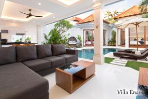a living room with a couch and a table at Villa Mia Seminyak - Boutique Villas in Seminyak